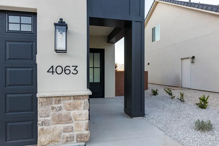 Doorway to property with stucco siding