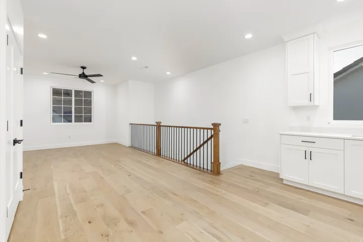 Spare room with light wood-type flooring, recessed lighting, and a ceiling fan