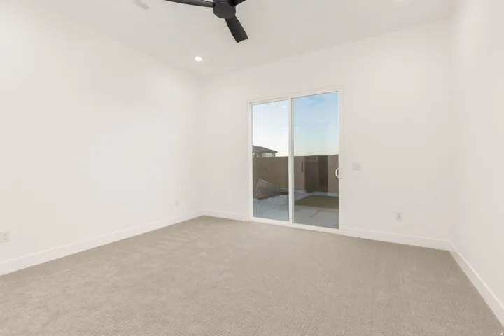 Unfurnished room with light carpet, ceiling fan, and recessed lighting