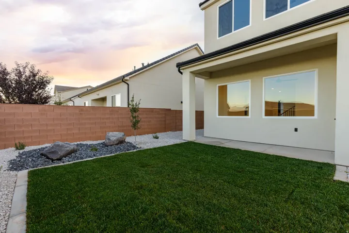 Fenced backyard with a patio