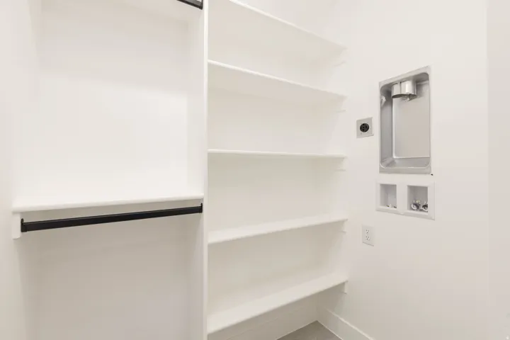 Laundry room with hookup for a washing machine and baseboards