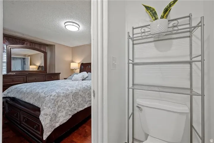 Bedroom with a textured ceiling