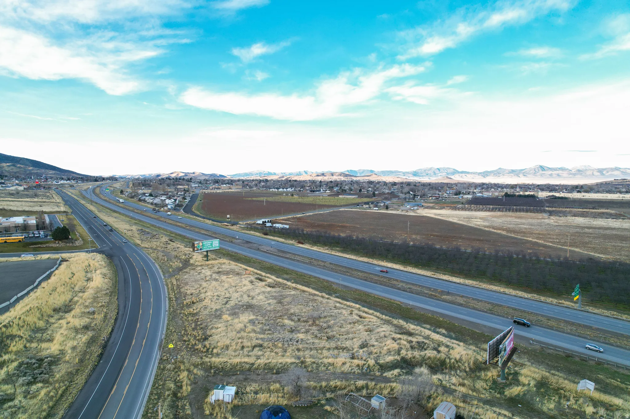 View of property location with a mountainous background and a highway