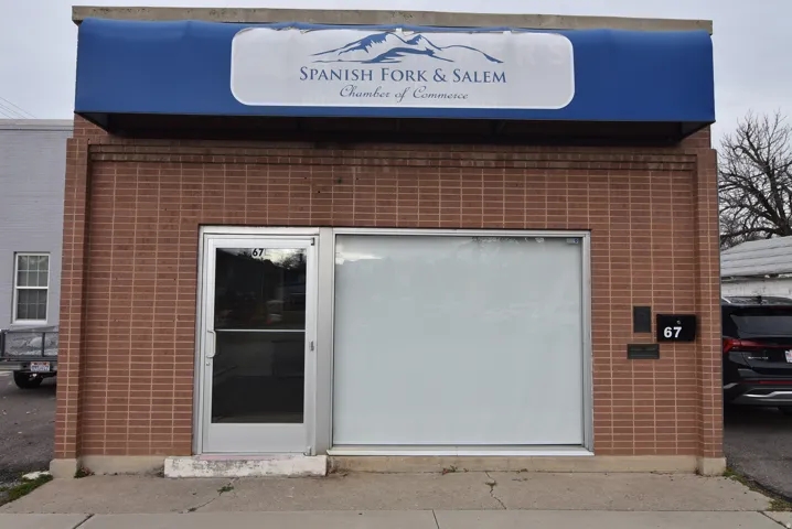 View of exterior entry with brick siding