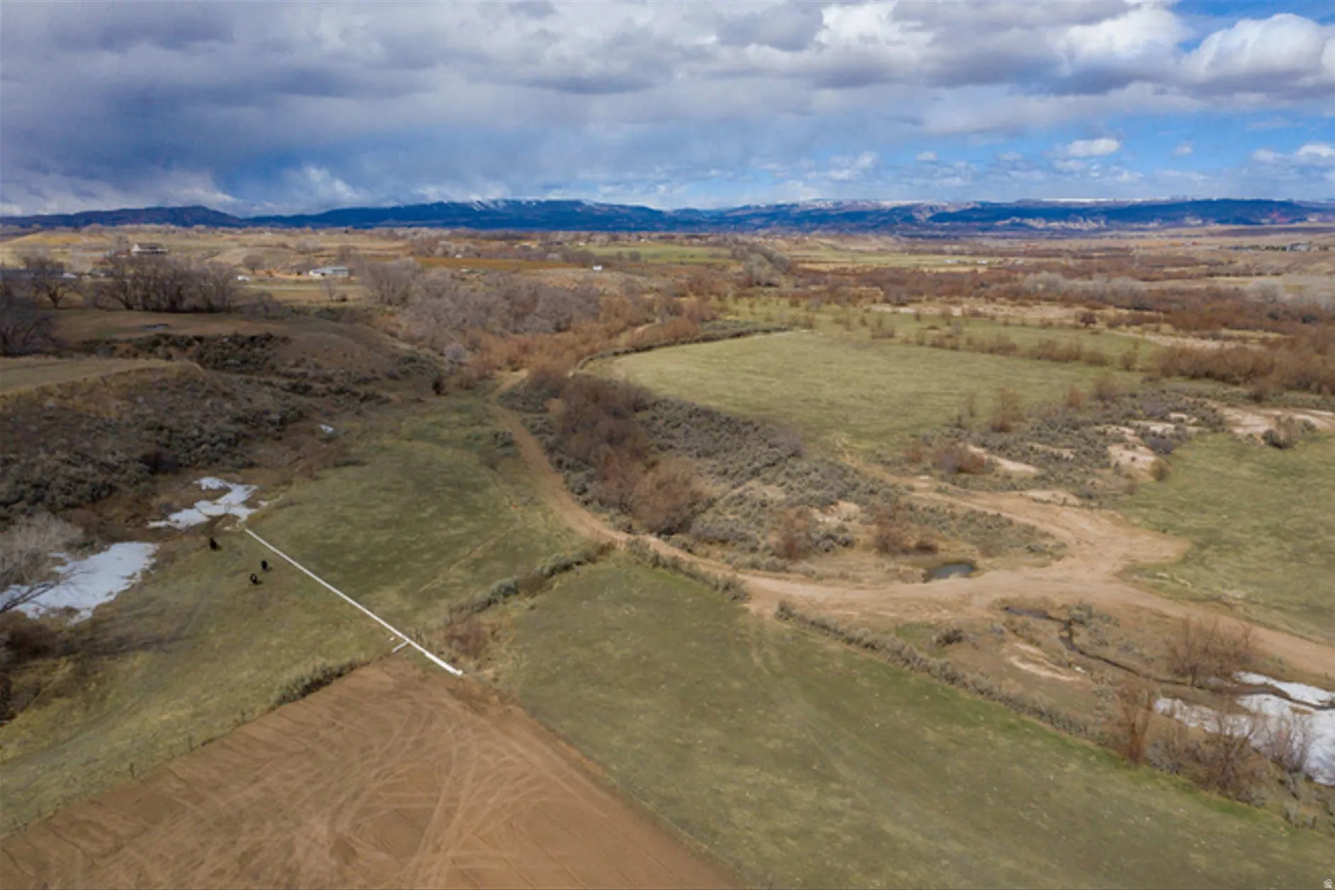 View of rural area with a mountainous background
