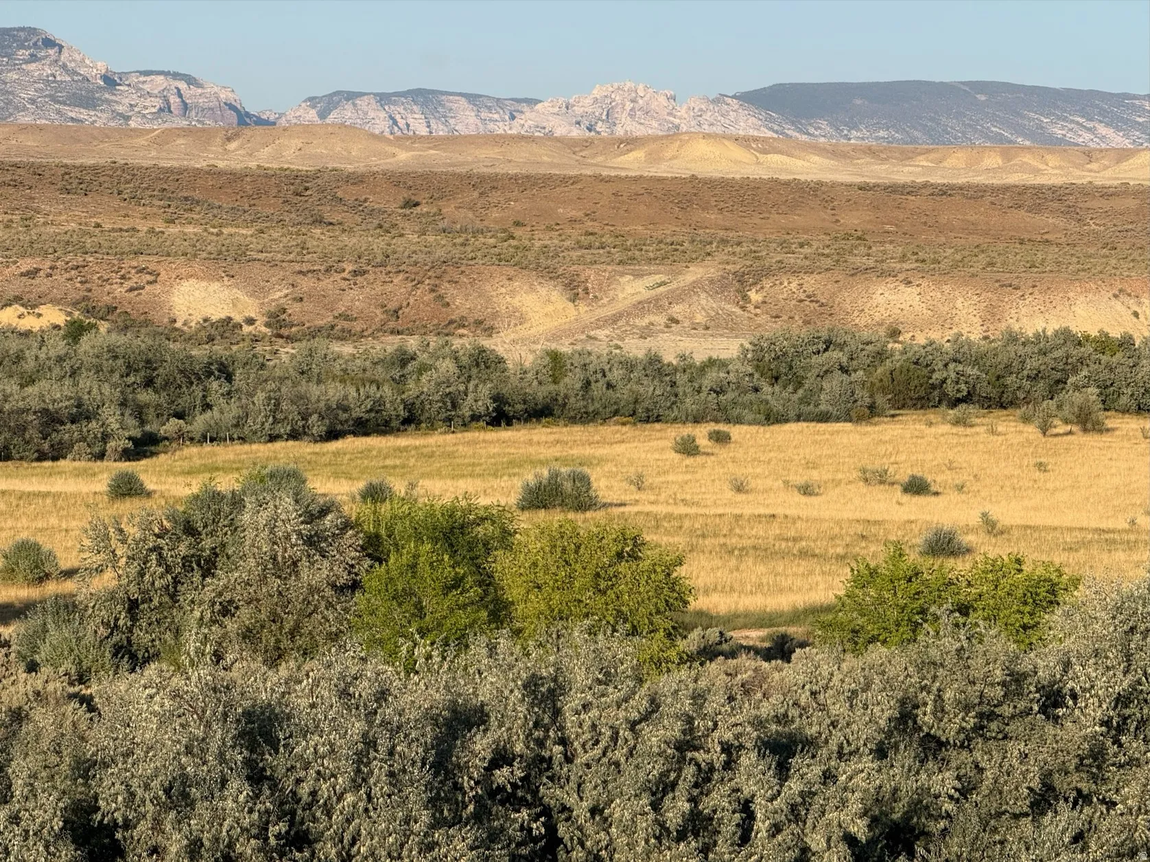 View of mountain backdrop featuring rural landscape