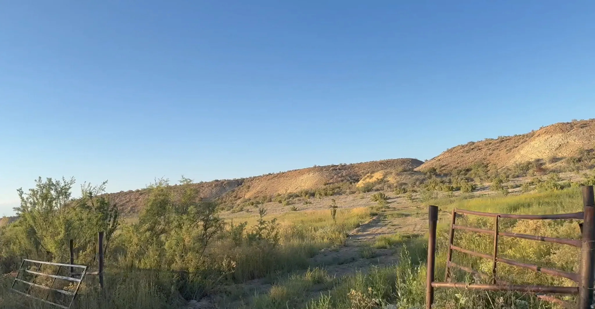 View of mountain backdrop featuring rural landscape