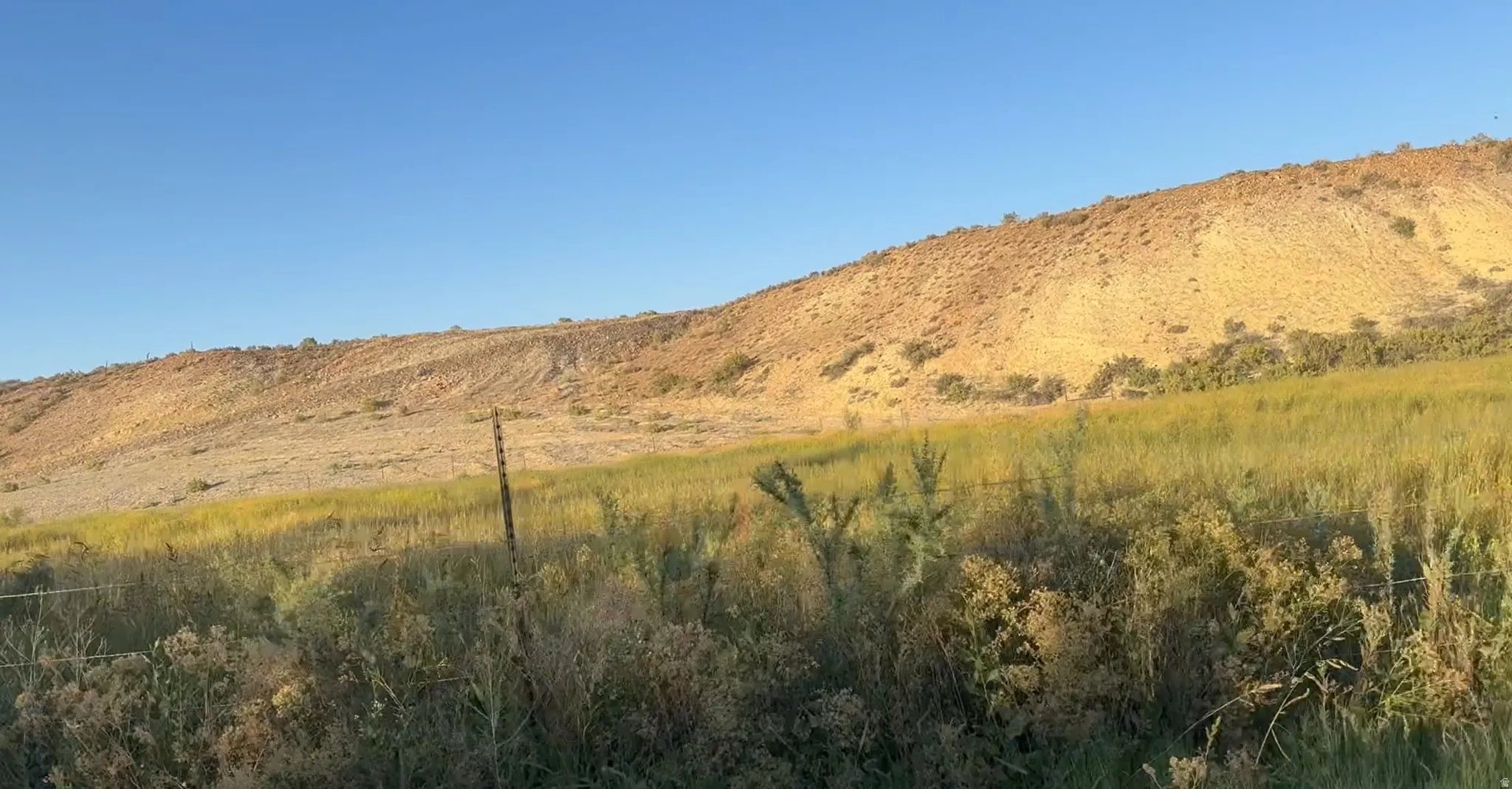 View of mountain background featuring rural landscape