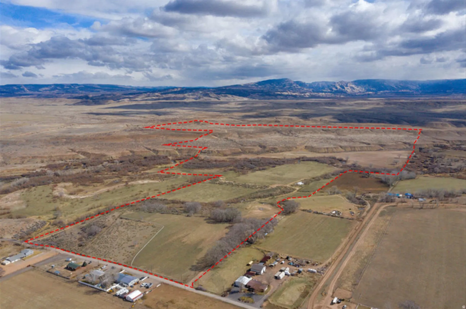 View of rural area with property parcel outlined and mountains