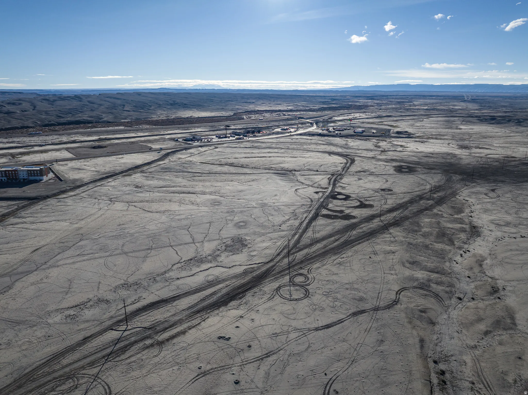 Aerial view of sparsely populated area with a mountainous background