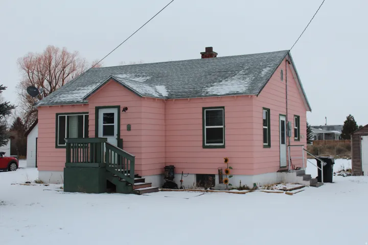 Bungalow-style house with a chimney and a shingled roof