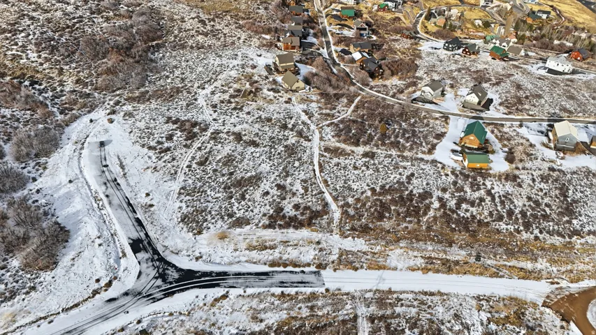 Snowy aerial view with a residential view