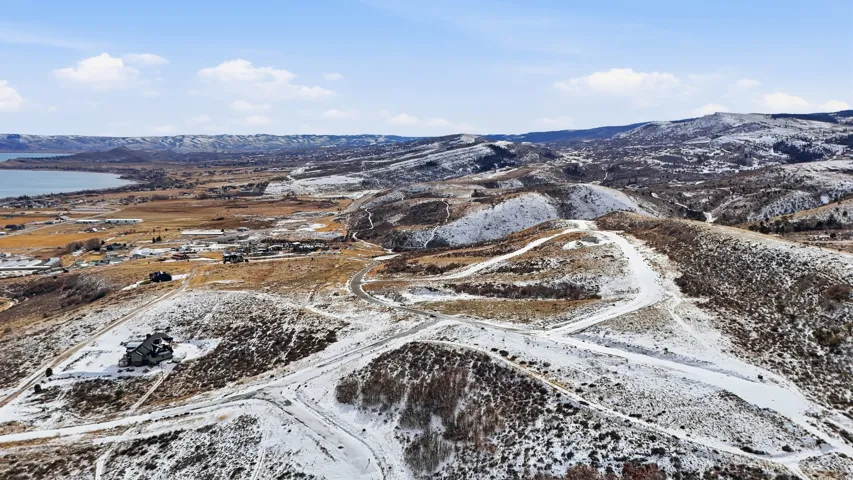 Snowy aerial view featuring a mountain view