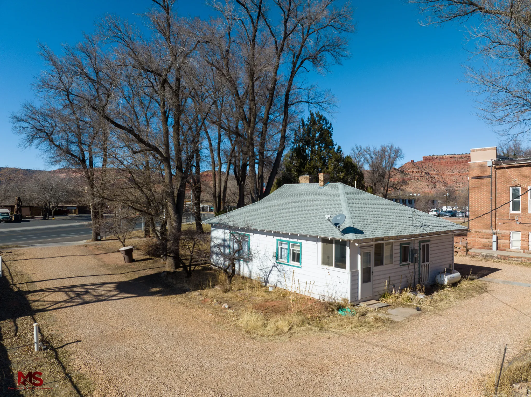 View of side of property featuring a mountain view and a chimney