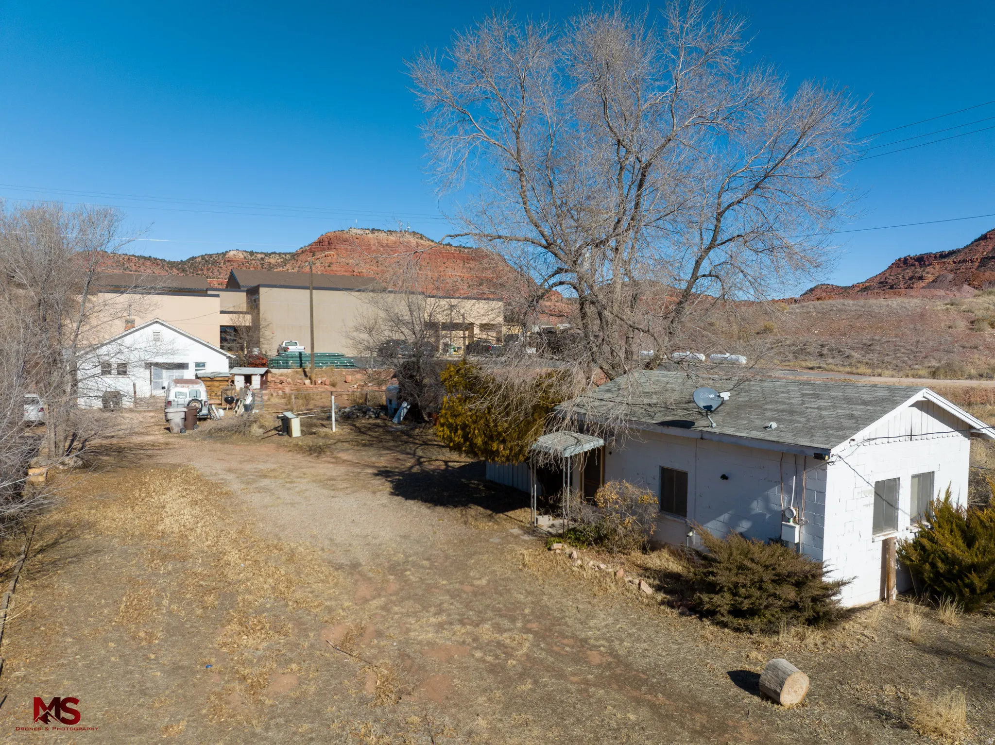 View of side of home with a mountain view