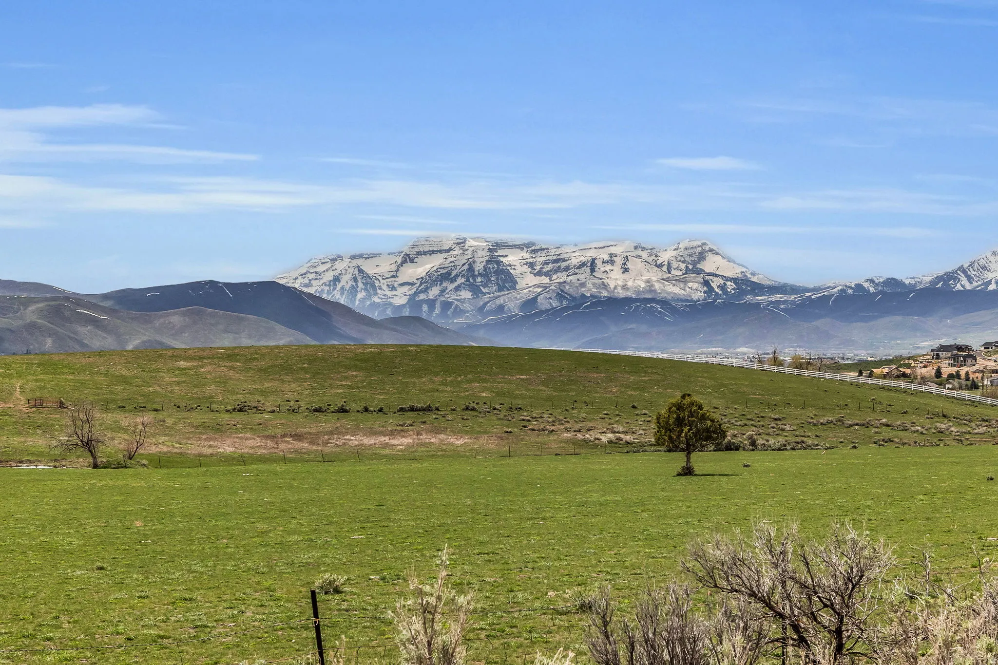 View of mountain background featuring rural landscape