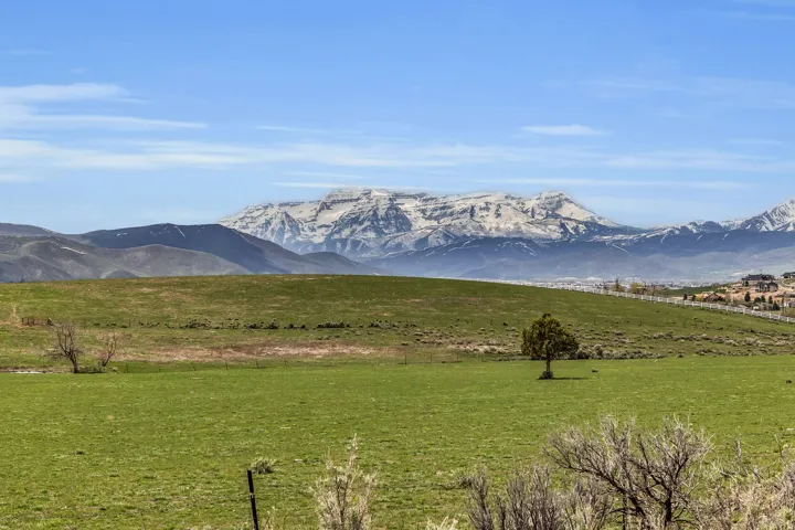 View of mountain background featuring rural landscape
