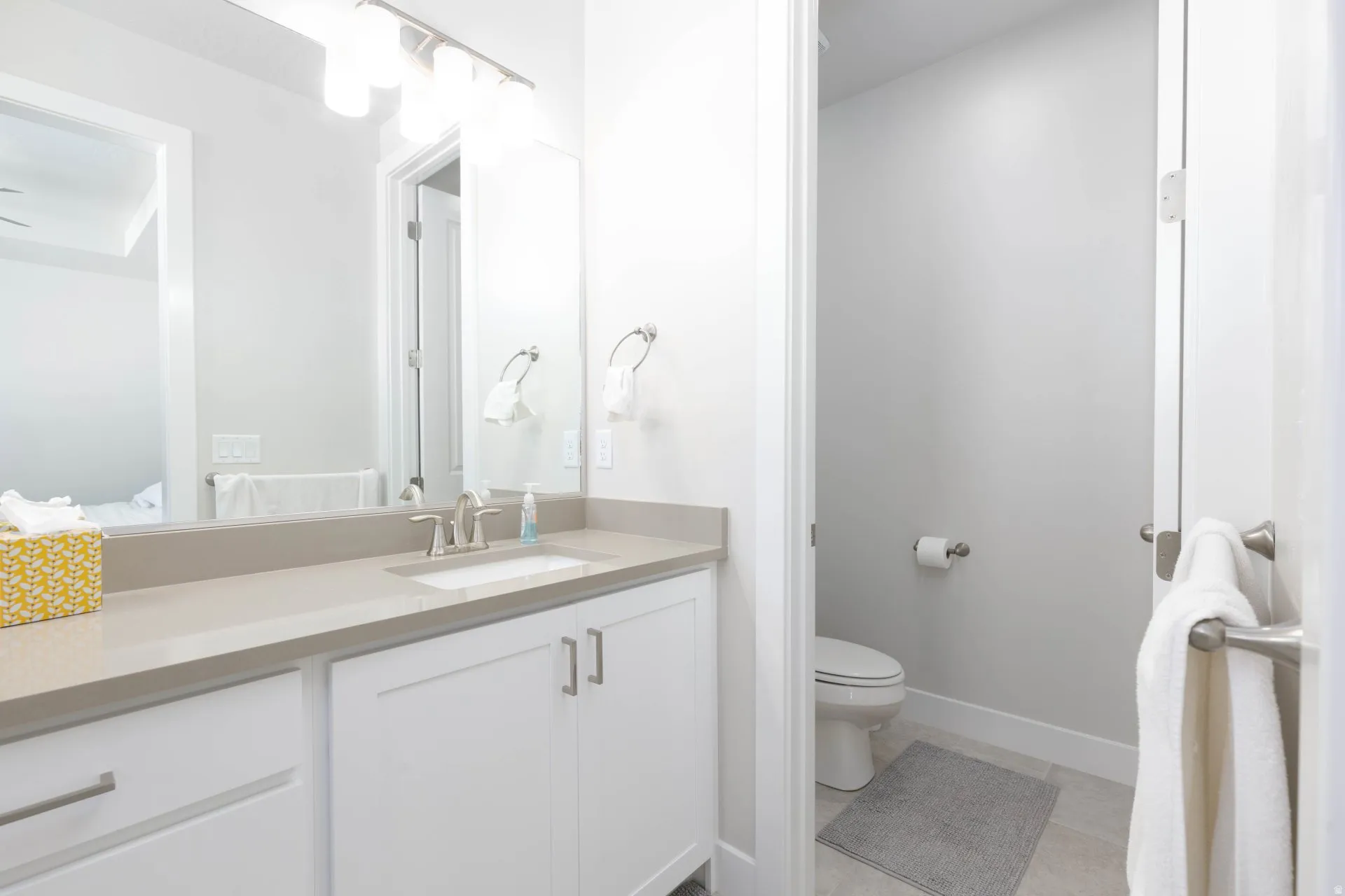 Bathroom with vanity and light tile patterned floors