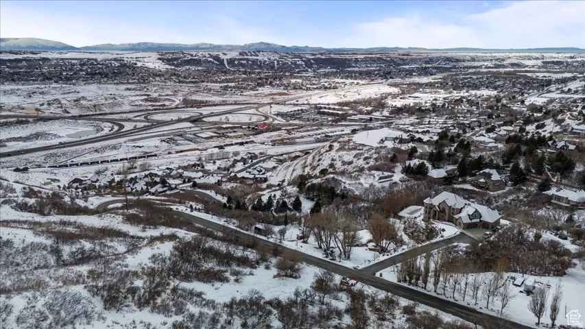 Snowy aerial view featuring a mountain view