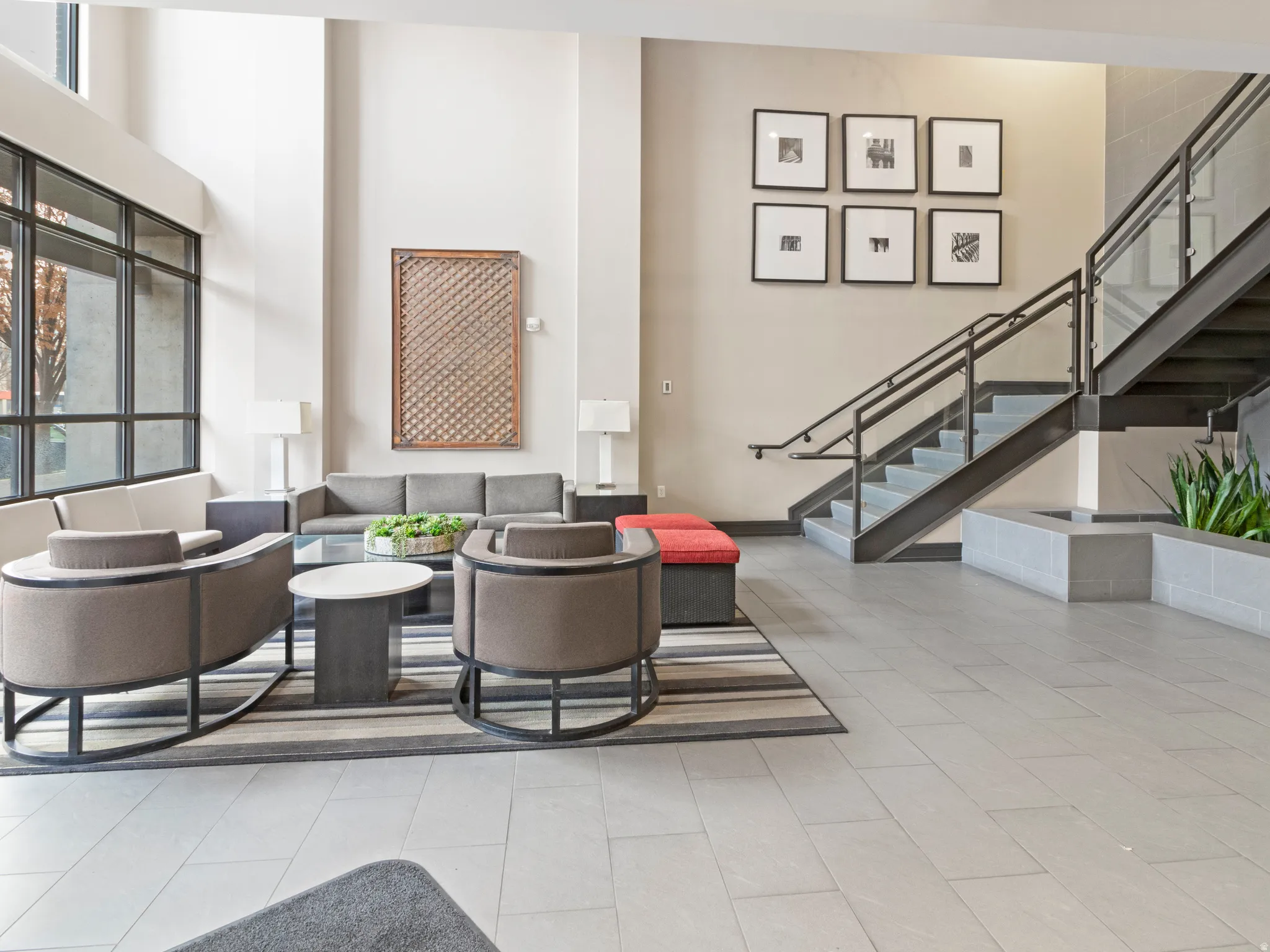 Community lobby with stairs and a high ceiling