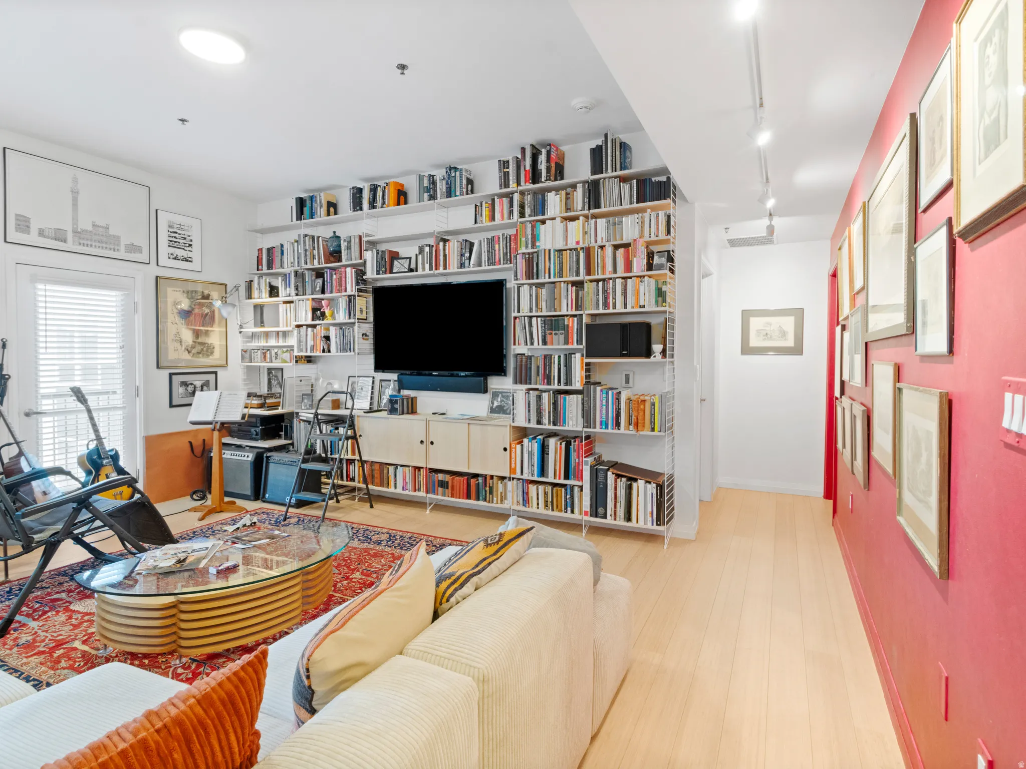 With floor to ceiling bookshelves (built-in, cost @$5K)