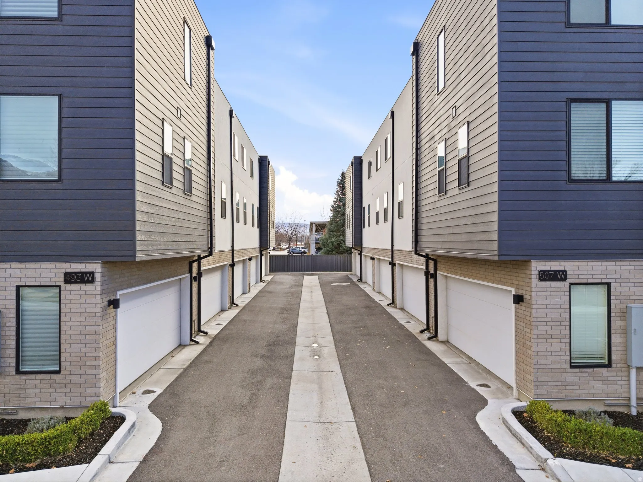 View of asphalt road with a residential view
