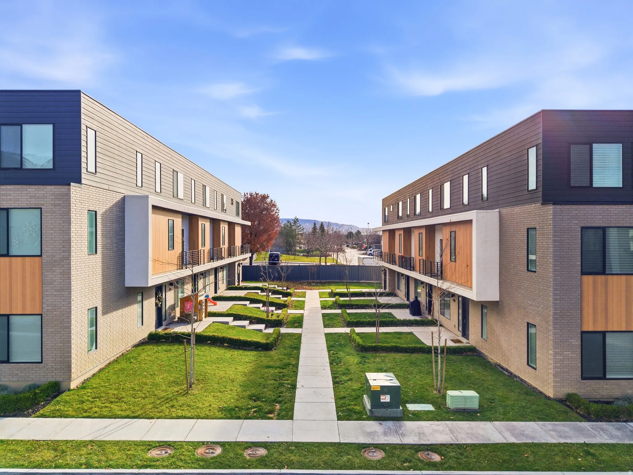 View of property's community featuring a yard and a residential view