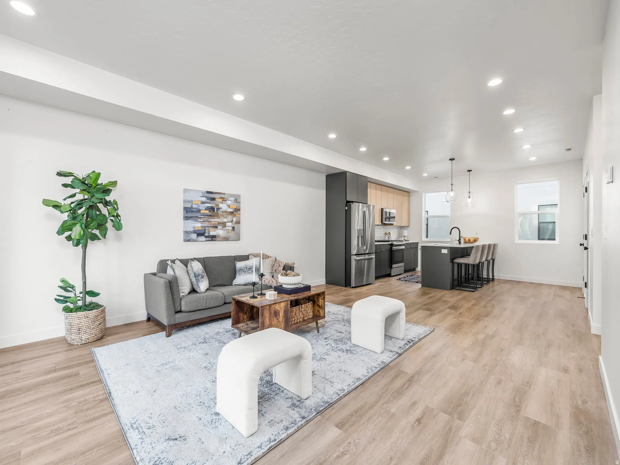 Living room featuring recessed lighting and light wood-style floors