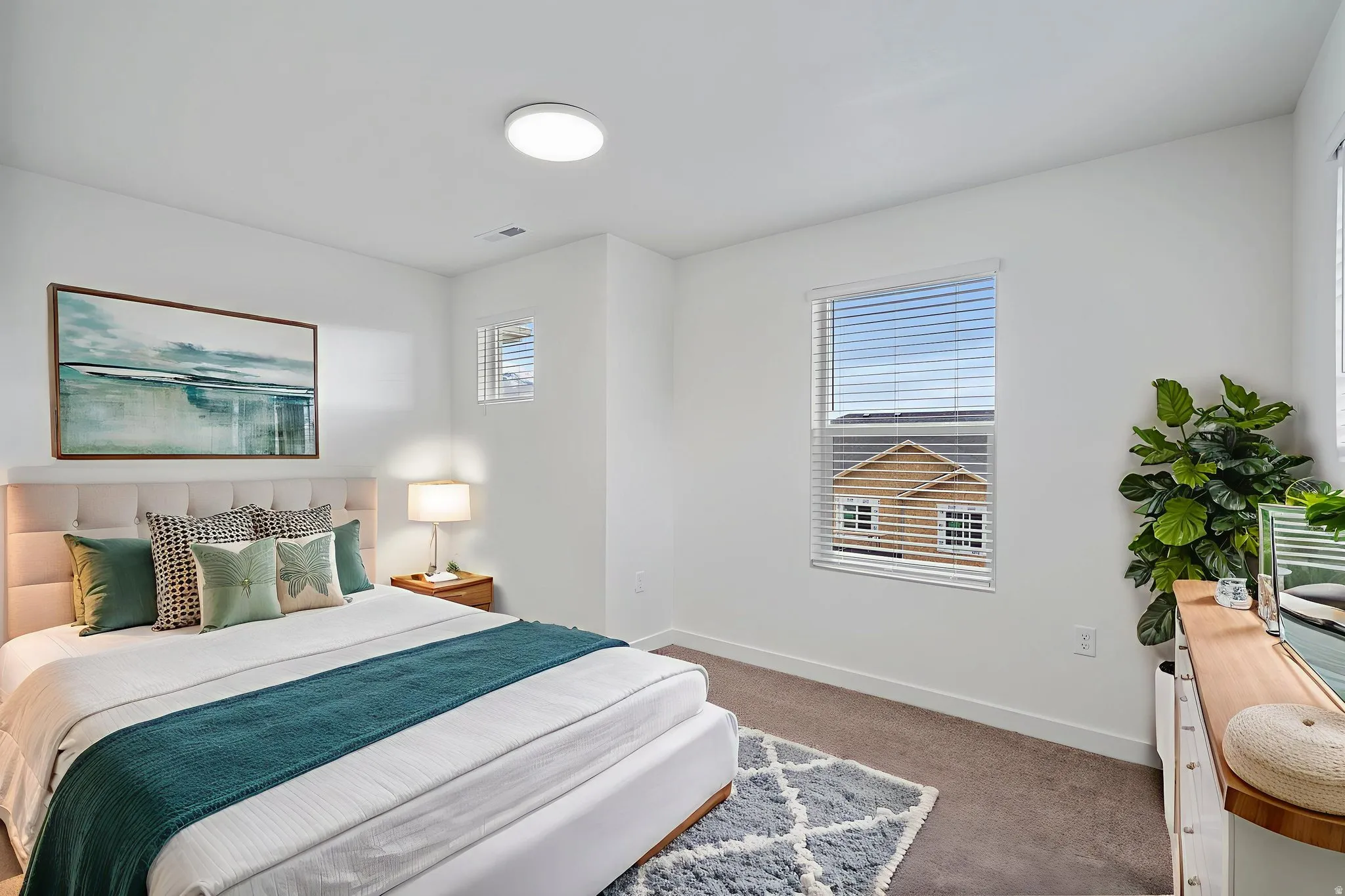 Carpeted bedroom featuring baseboards