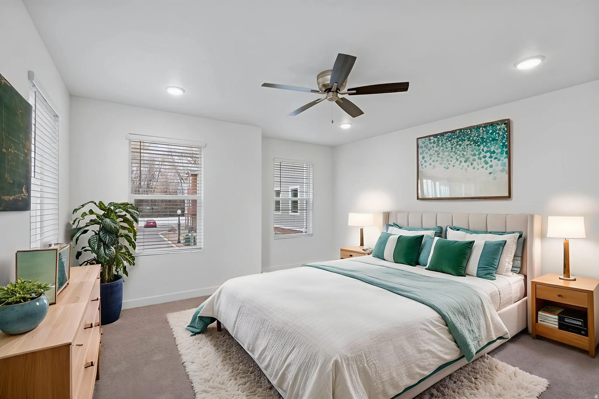 Carpeted bedroom with ceiling fan and recessed lighting