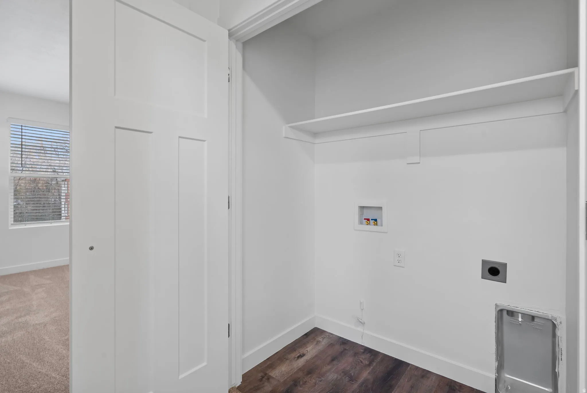 Laundry room featuring washer hookup, hookup for an electric dryer, and dark wood finished floors