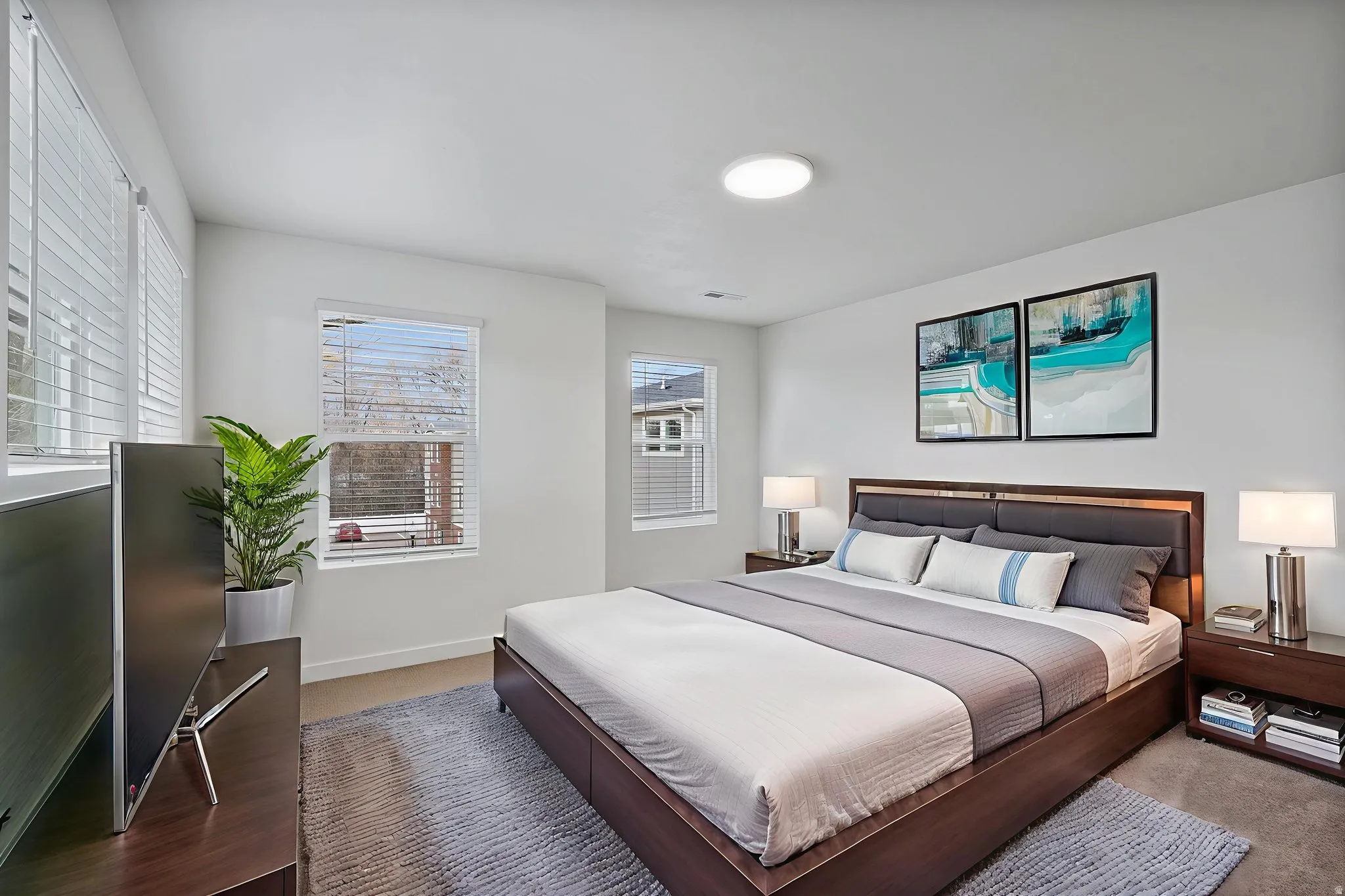 Bedroom with multiple windows