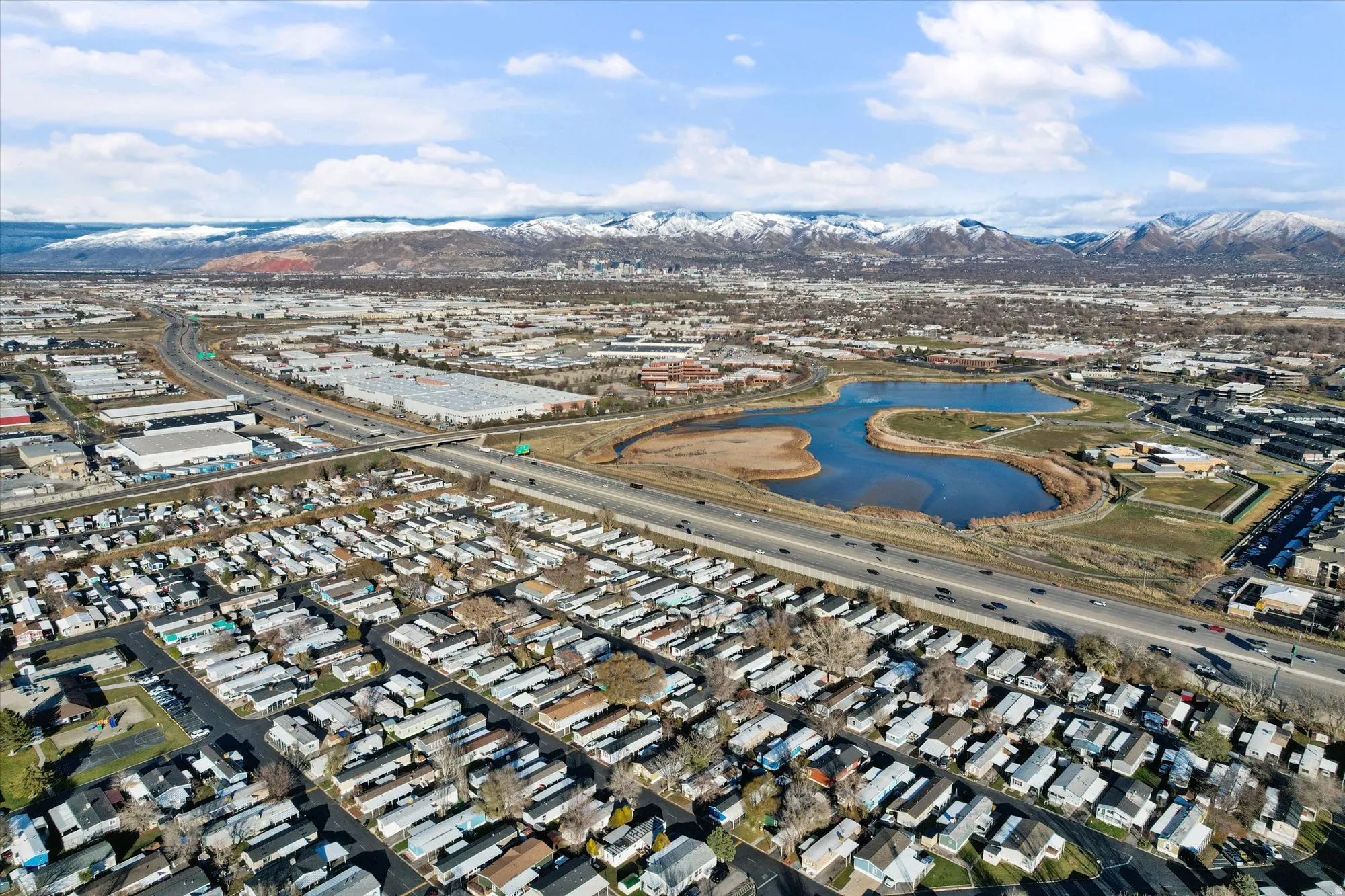 Aerial view of property's location with a water and mountain view