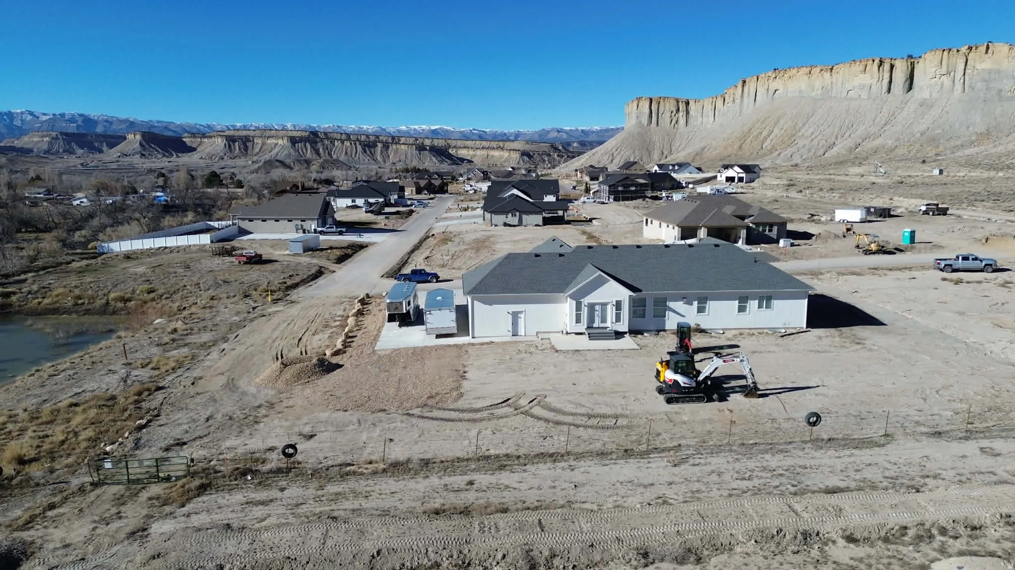 Aerial perspective of suburban area featuring a mountain backdrop