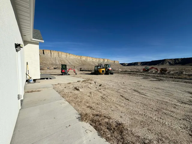 View of yard with a mountain view and a patio