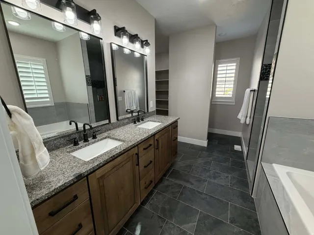 Bathroom with a bath and double vanity