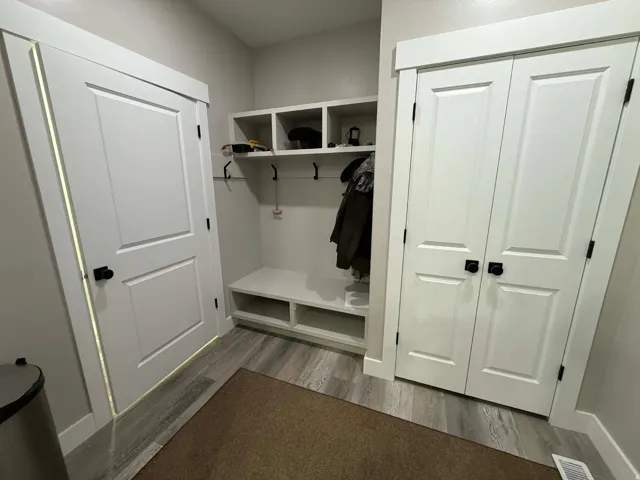 Mudroom with light wood finished floors