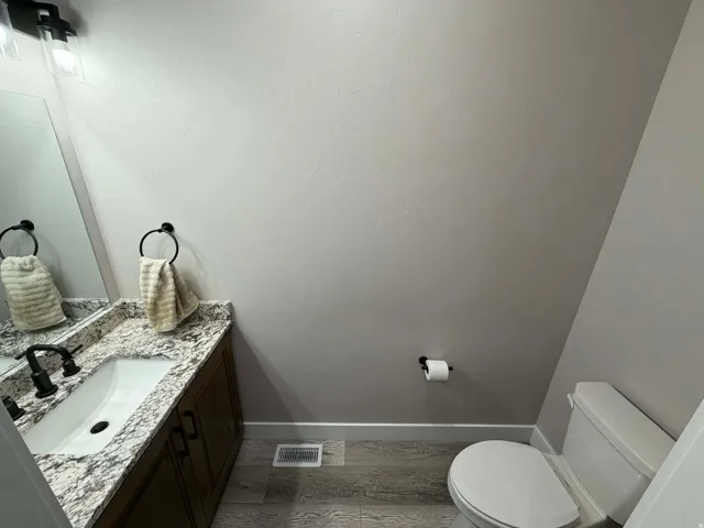 Bathroom featuring vanity and light wood-style floors