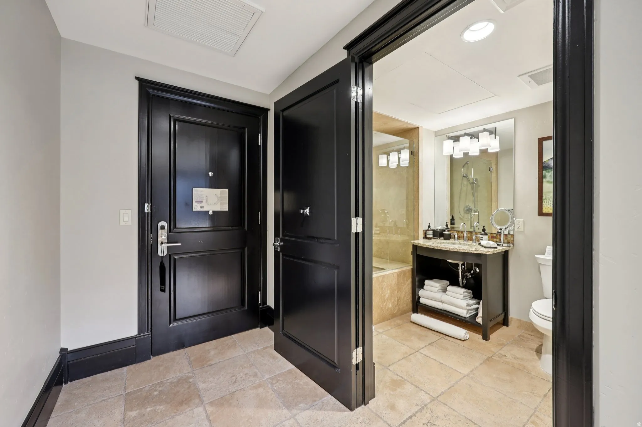 Entryway featuring baseboards and recessed lighting