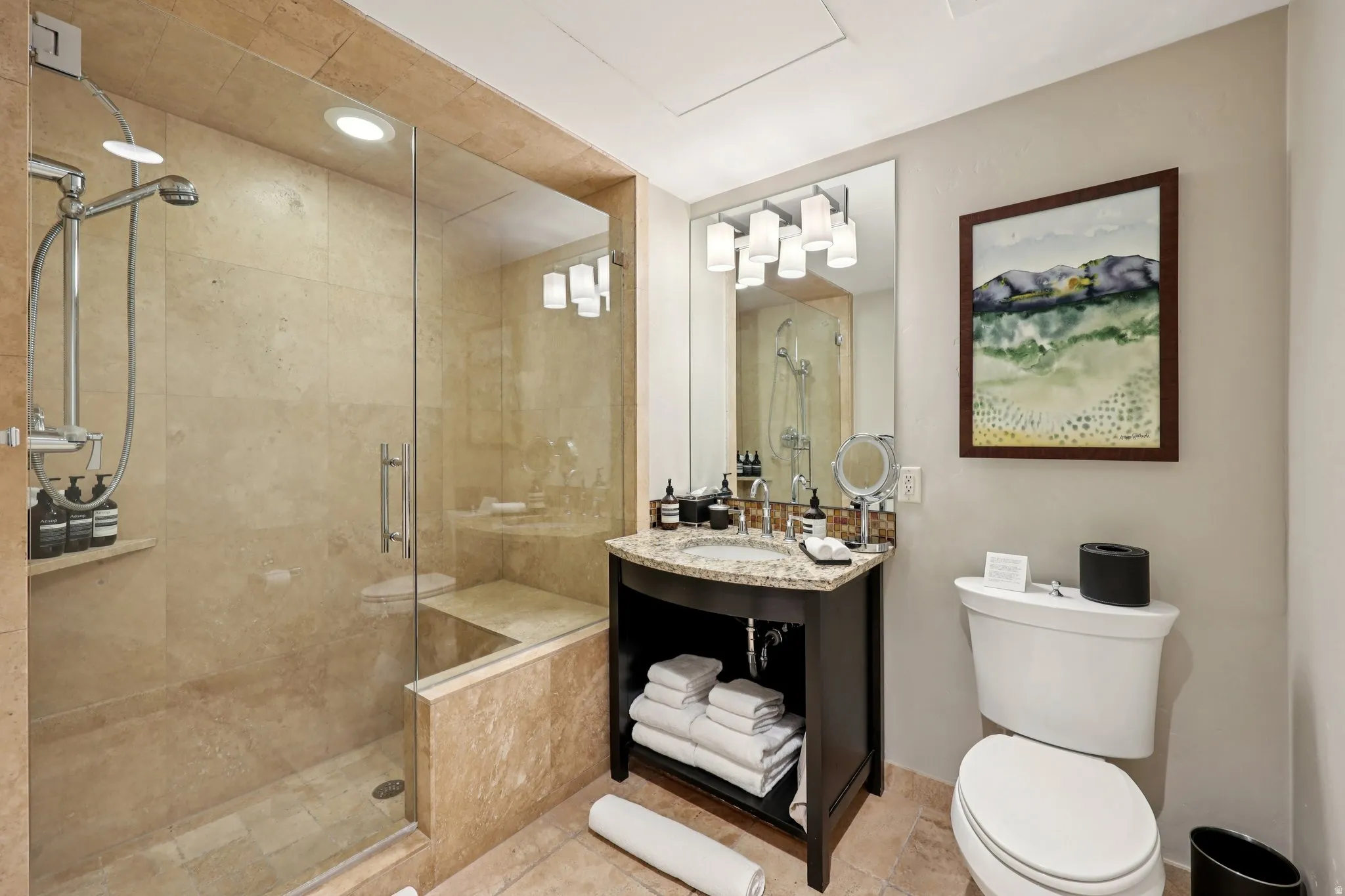 Bathroom with vanity, a shower stall, and recessed lighting