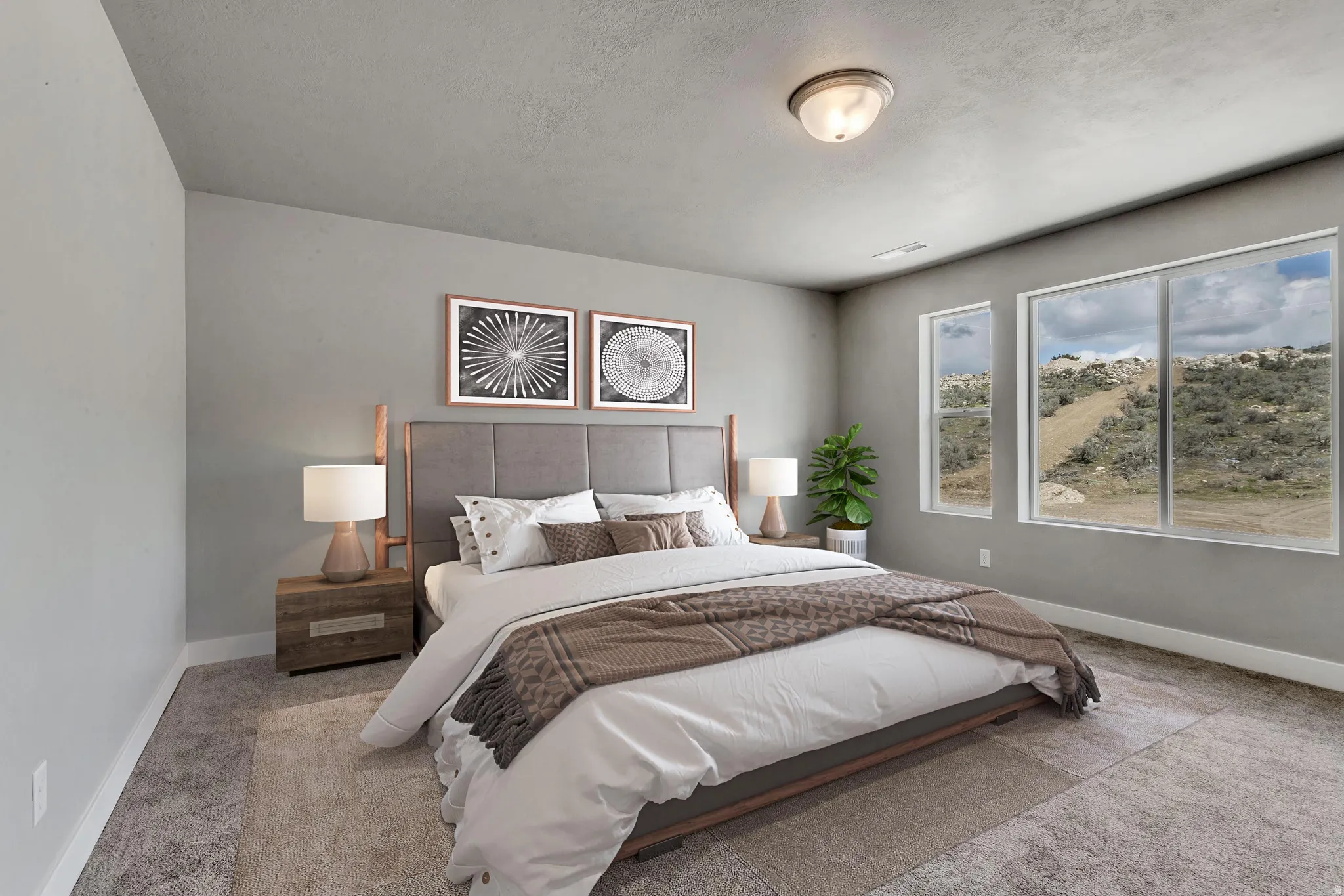 Bedroom featuring light carpet and a textured ceiling