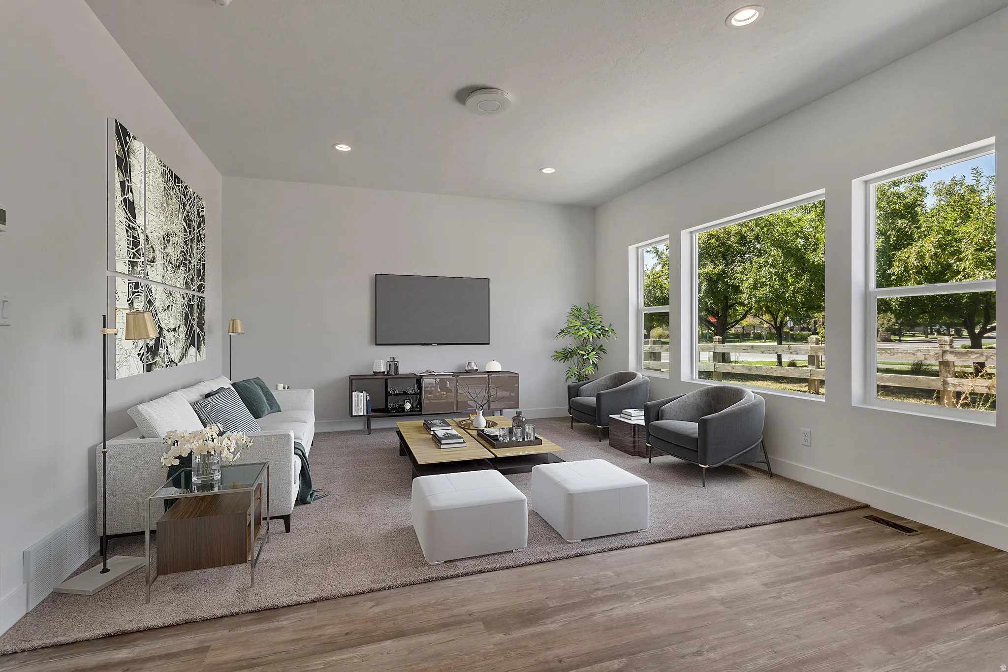 Living area featuring light wood-style floors and recessed lighting