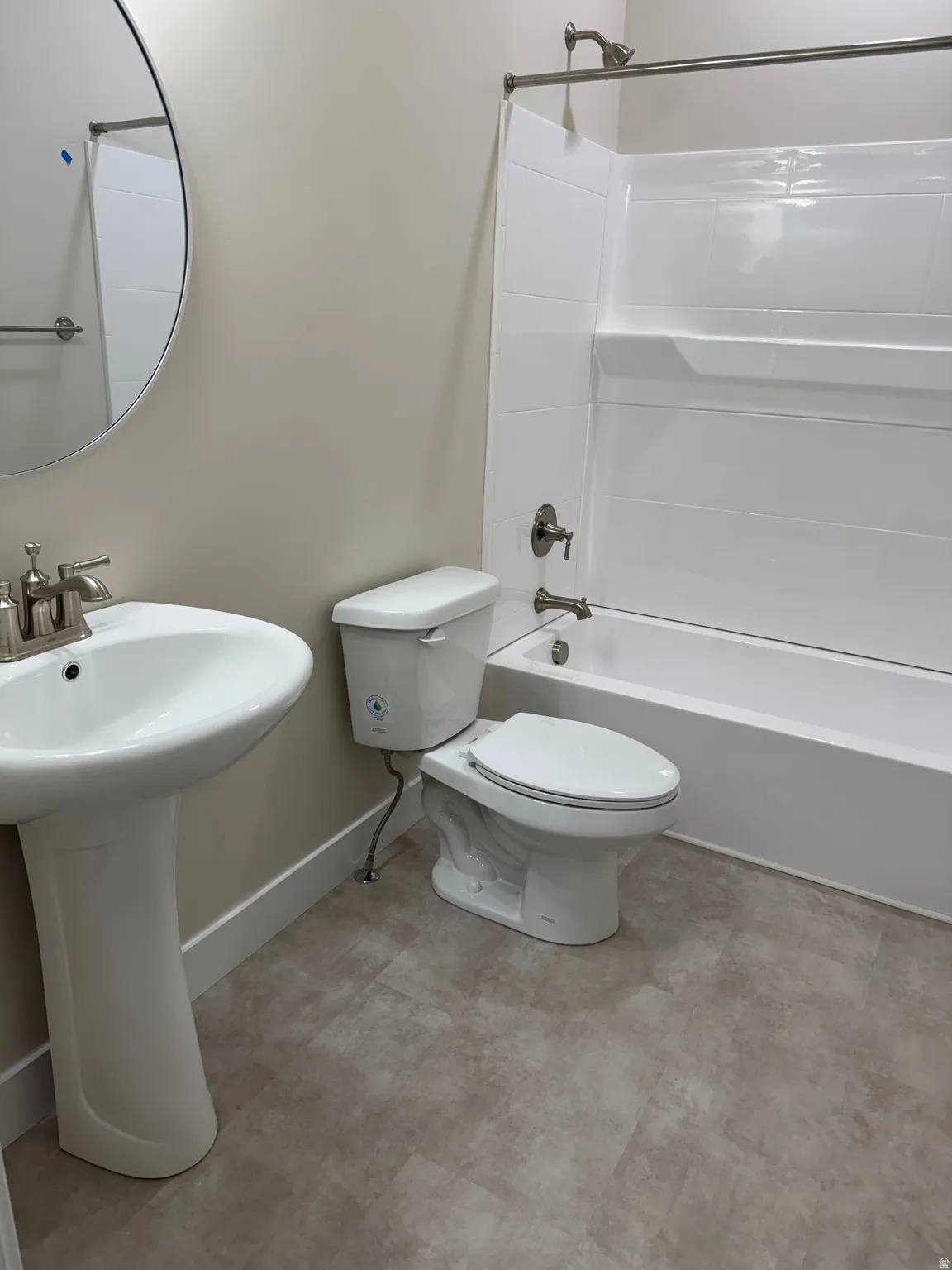 Bathroom featuring shower / tub combination and toilet