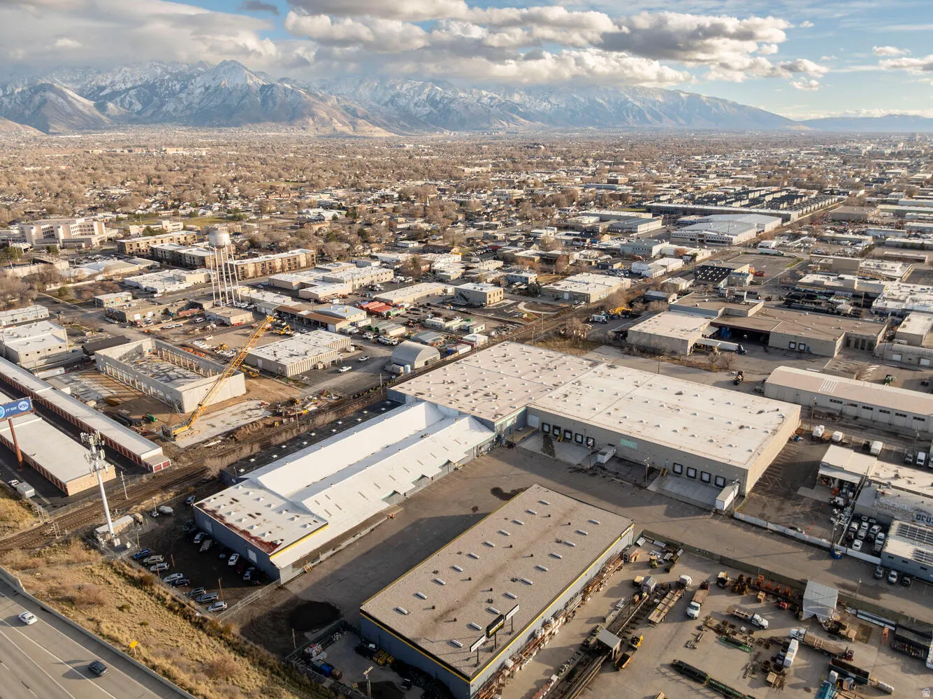 Bird's eye view of industrial structures and mountains