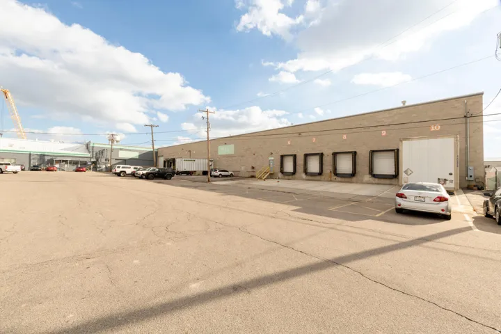 View of property with uncovered parking