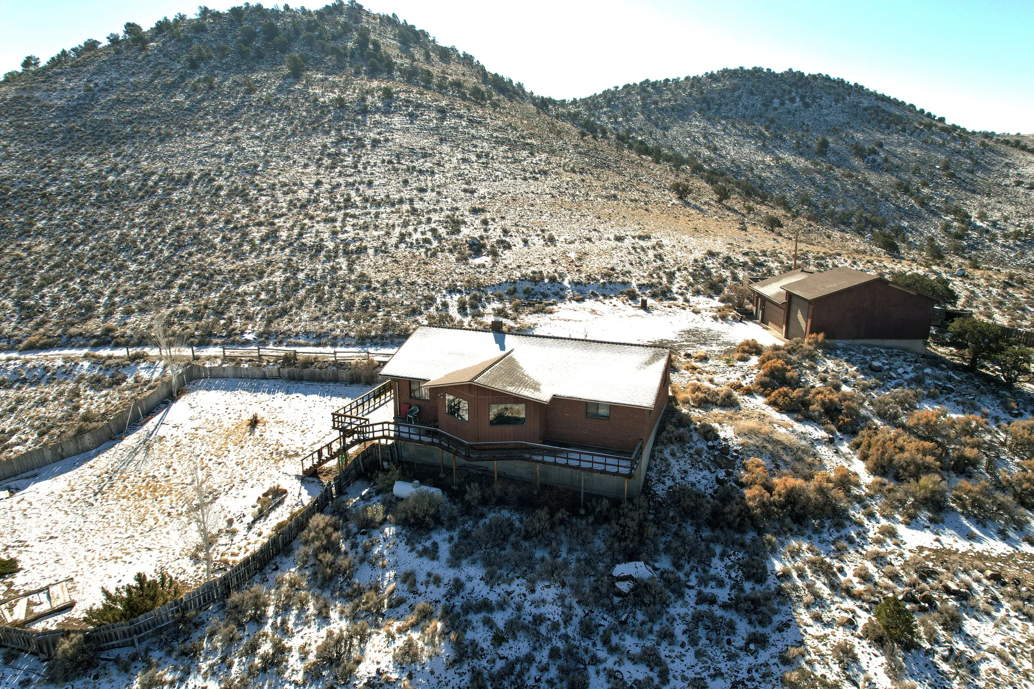 Snowy aerial view with a mountain view