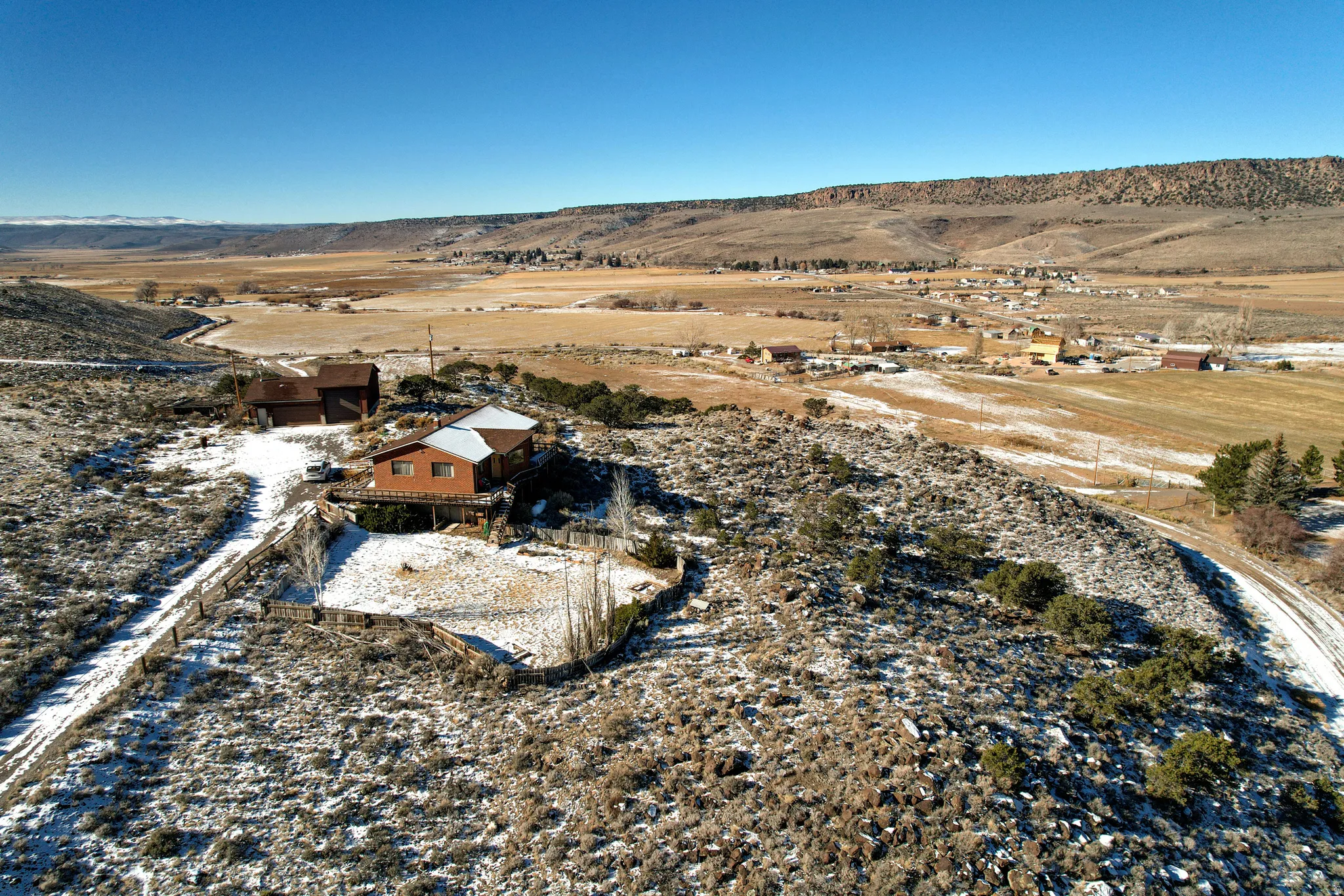 Aerial view of property and surrounding area with rural landscape