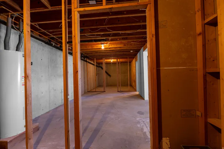 Unfinished basement with electric water heater