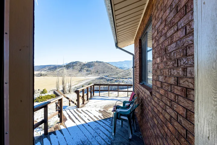 Wooden deck featuring a mountain view