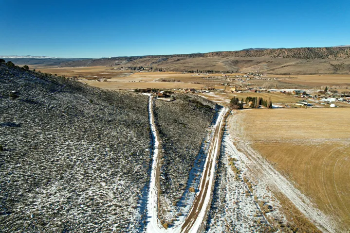 Aerial view of sparsely populated area featuring a mountain backdrop